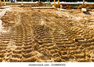 Bulldozer Tracks In Dirt On Construction Site