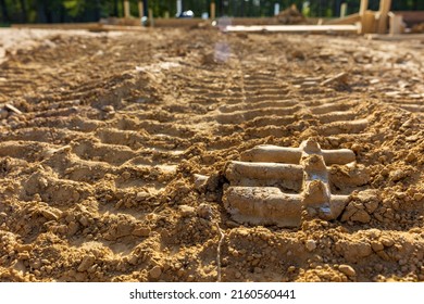 Bulldozer Tracks In Dirt On Construction Site