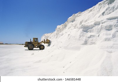 Bulldozer Truck Loading Salt At Refining Plant