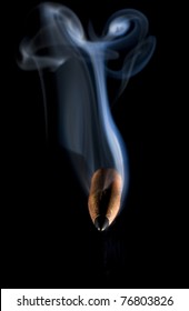 Bullet coming from the dark that is trailed by smoke