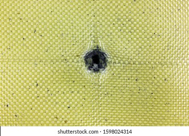 Bullet Damage In The Kevlar Fabric Of The Bulletproof Vest, After Being Fired From A Kalashnikov (AK-47) From A Distance Of 1 Meter (1.09 Yards)