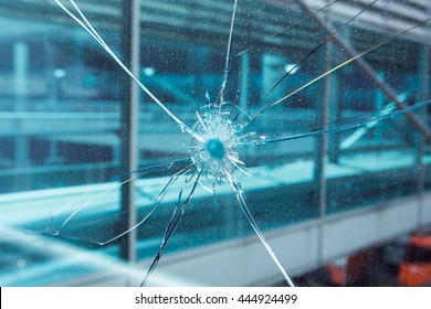 Bullet hole in glass.