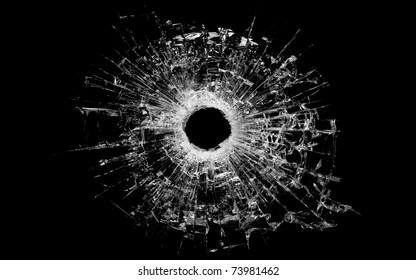bullet hole in glass - real bullet hole closeup and isolated on black