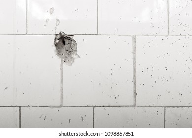 Bullet Hole In Old Wall Close Up