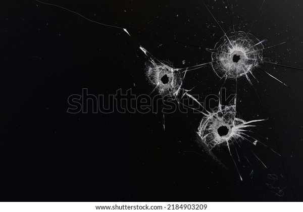 Bullet Hole On Glass Black Background Stock Photo 2184903209 | Shutterstock