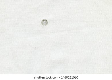 Bullet Hole On A White Cloth, Abstract Background.