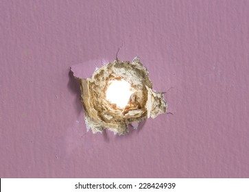 Bullet Hole In Painted Wood