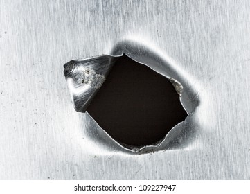 Bullet Hole In Sheet Metal