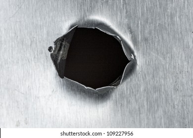 Bullet Hole In Sheet Metal