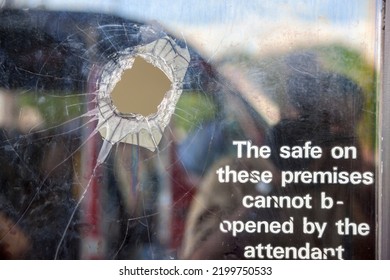 Bullet Hole In A Shop Window, Signage About The Safe