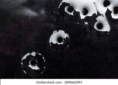 Bullet Holes In Aluminum Car Door Close Up