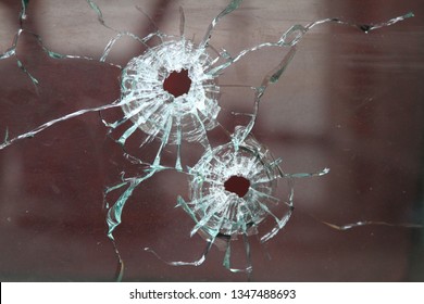 Bullet Holes In Bank Window Mirror