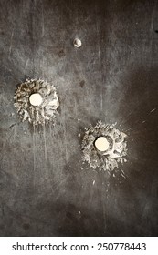 Bullet Holes In Metal Surface