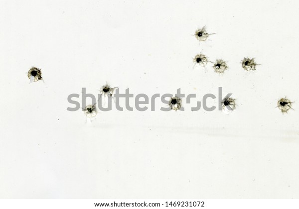 Bullet Holes On White Sheet Paper Stock Photo (Edit Now) 1469231072
