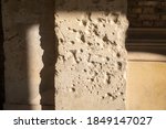 bullet holes from the second world war in a wall on the museum island in berlin mitte. 