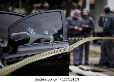 Bullet Holes Are Seen In The Window Of A Car After A Armed Robbery Shot In Sao Paulo, Brazil.