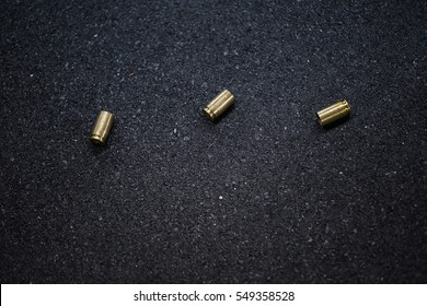 Bullet Shells Ground. Cases Of Bullets Lying On The Floor Of Asphalt