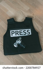 Bulletproof Vest Press And Camera, Photojournalist Concept