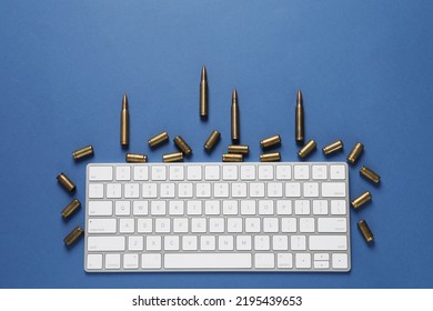 Bullets And Computer Keyboard On Blue Background, Flat Lay. Hybrid Warfare Concept