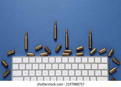 Bullets And Computer Keyboard On Blue Background, Flat Lay. Hybrid Warfare Concept