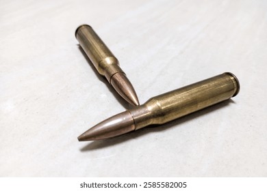 Bullets on white background. Firearm ammunition