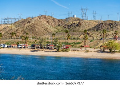 Bullhead City, AZ / USA – February 17, 2020: Large group of recreational vehicles at Davis Campground on the Colorado River located north of Bullhead City, Arizona. 