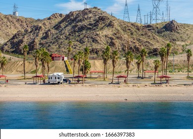 Bullhead City, AZ / USA – February 17, 2020: RV camping spots at Davis Campground on the Colorado River located north of Bullhead City, Arizona.