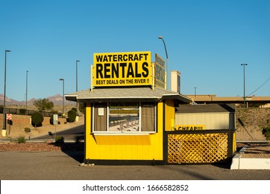 Bullhead City, AZ / USA – February 19, 2020: Small yellow shack building for watercraft rentals business for the Colorado River located in Bullhead City, Arizona. 
