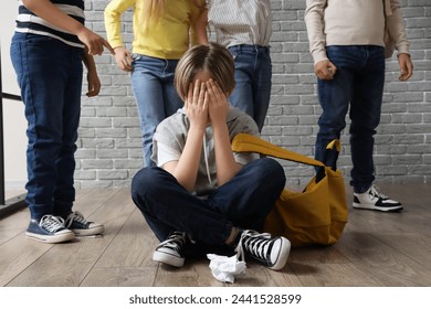 Bullied little boy crying at school - Powered by Shutterstock