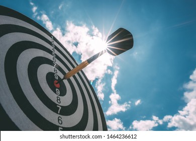 Bullseye is a target of business. Dart is an opportunity and Dartboard is the target and goal. So both of that represent a challenge in business marketing as concept. - Shutterstock ID 1464236612