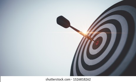 Bullseye is a target of business. Dart is an opportunity and Dartboard is the target and goal. So both of that represent a challenge in business marketing as concept. - Shutterstock ID 1526818262