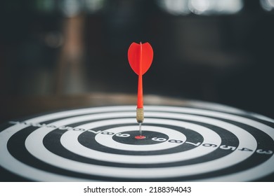Bullseye is a target of business.  Dartboard is the target and goal. So both of that represent a challenge in business marketing as concept. - Shutterstock ID 2188394043