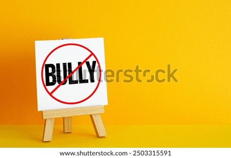 Bully free zone is shown using a text. Stop bullying at work and school