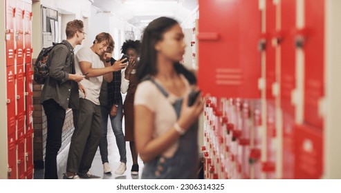 Bully, students and girl in high school, anxiety and stress with depression, sad and social issue. Female person, young people and teenager with mental health, locker and harassment with gossip - Powered by Shutterstock