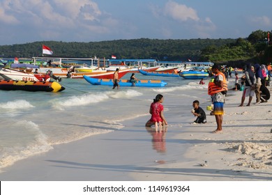 BULUKUMBA, INDONESIA - AUGUST 5 2018: Children Are Playing On Bira Beach In Bulukumba Regency. The Children Play Sand And Ball