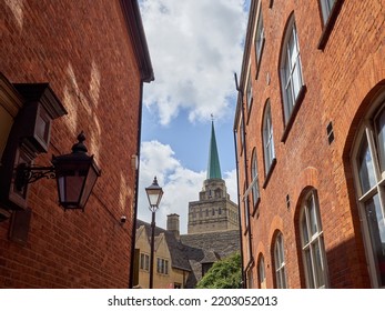 Bulwarks Lane with red brick buildings and the view of the tower and the spire of Nuffield College. Oxford, England, UK, Europe - Shutterstock ID 2203052013