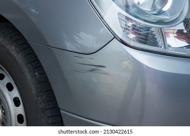 Bumper car scratched with deep damage to the paint. Dent car scratch. Crashed car in accident. 