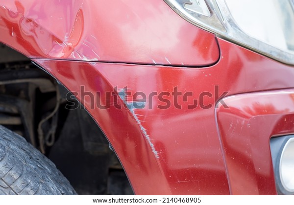 Bumper car scratched with deep\
damage to the paint. Dent car scratch. Crashed car in\
accident.