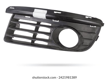 bumper grille for anti fog light on a white background made of plastic is an element of the car body that protects and passes air to the engine. Design element and tuning replacement in the workshop.