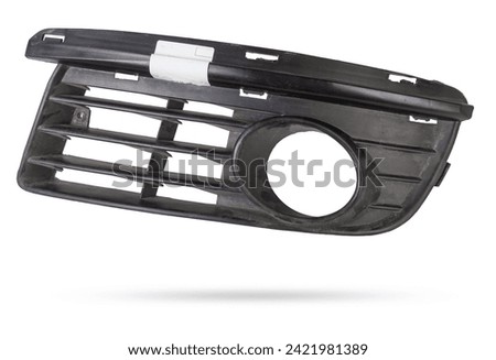 bumper grille for anti fog light on a white background made of plastic is an element of the car body that protects and passes air to the engine. Design element and tuning replacement in the workshop.