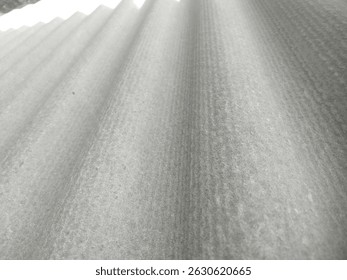 Bumpy asbestos surface. Repeated up and down patterns