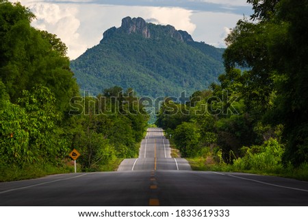 Bumpy asphalt road on hill in Lampang Thailand