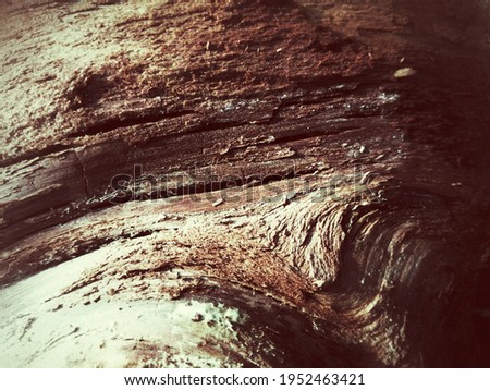 A bumpy wooden surface with lines