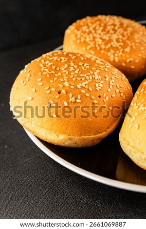 Bun burger puffy soft buns baking fresh delicious gourmet food background on the table rustic food top view copy space