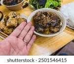 Bun cha is a famous Vietnamese noodle dish with grilled pork served with fresh herbs, on a bamboo base. US President, Obama tried this dish in Hanoi when visiting the Vietnamese capital in 2016.