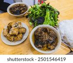 Bun cha is a famous Vietnamese noodle dish with grilled pork served with fresh herbs, on a bamboo base. US President, Obama tried this dish in Hanoi when visiting the Vietnamese capital in 2016.