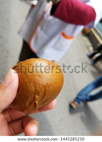 A bun stuffed with azuki-bean paste 
called onsen-manju sold in towns and resorts of hot springs.
