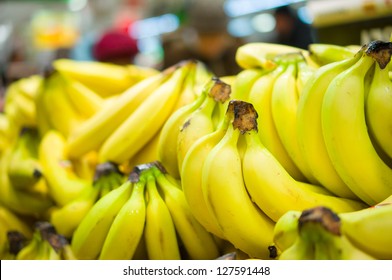 Bunch Of Bananas On Boxes In Supermarket