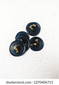 A bunch of black with gold foil blank wax stamp coins on a white background. Can be use for vintage antique wedding invitation or decoration - Shutterstock ID 2270406715