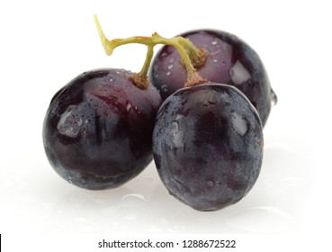 Bunch Of Black Grapes Isolated On White Background